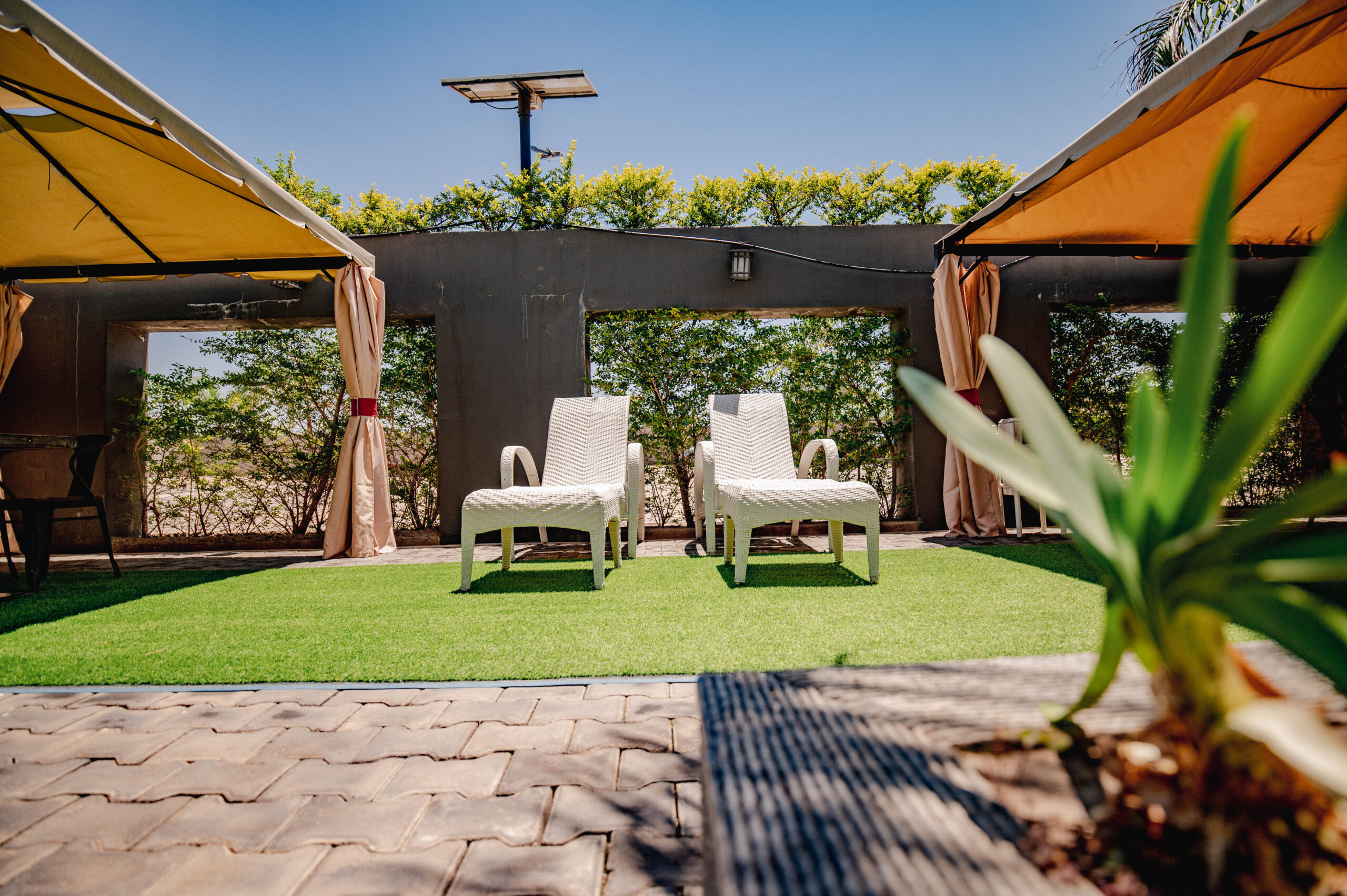 Sunlit pool with surrounding seating